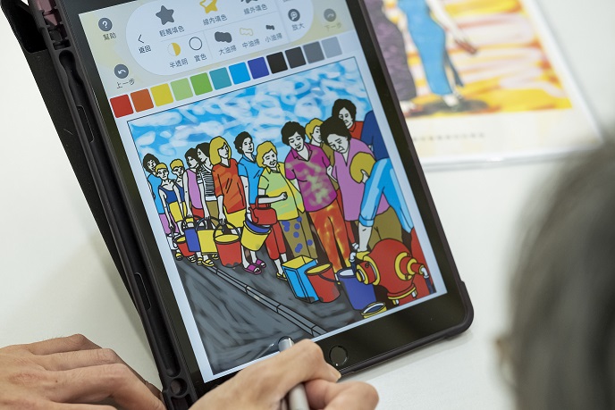 ayip completing a coloured drawing of the water rationing scene in the 